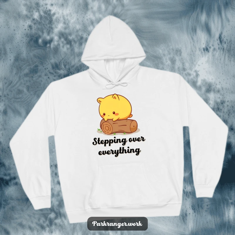 Funny Hoodie featuring a round yellow animal cautiously stepping over a fallen, miniature log, perfect for cozy wear.